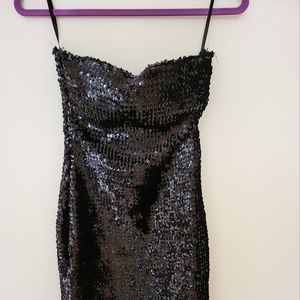 Black Mini sequent dress. Built in straps to easily hang in your closet.